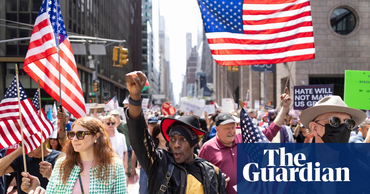 Protesters fill the streets in cities across the US to denounce Trump agenda | US news | The Guardian